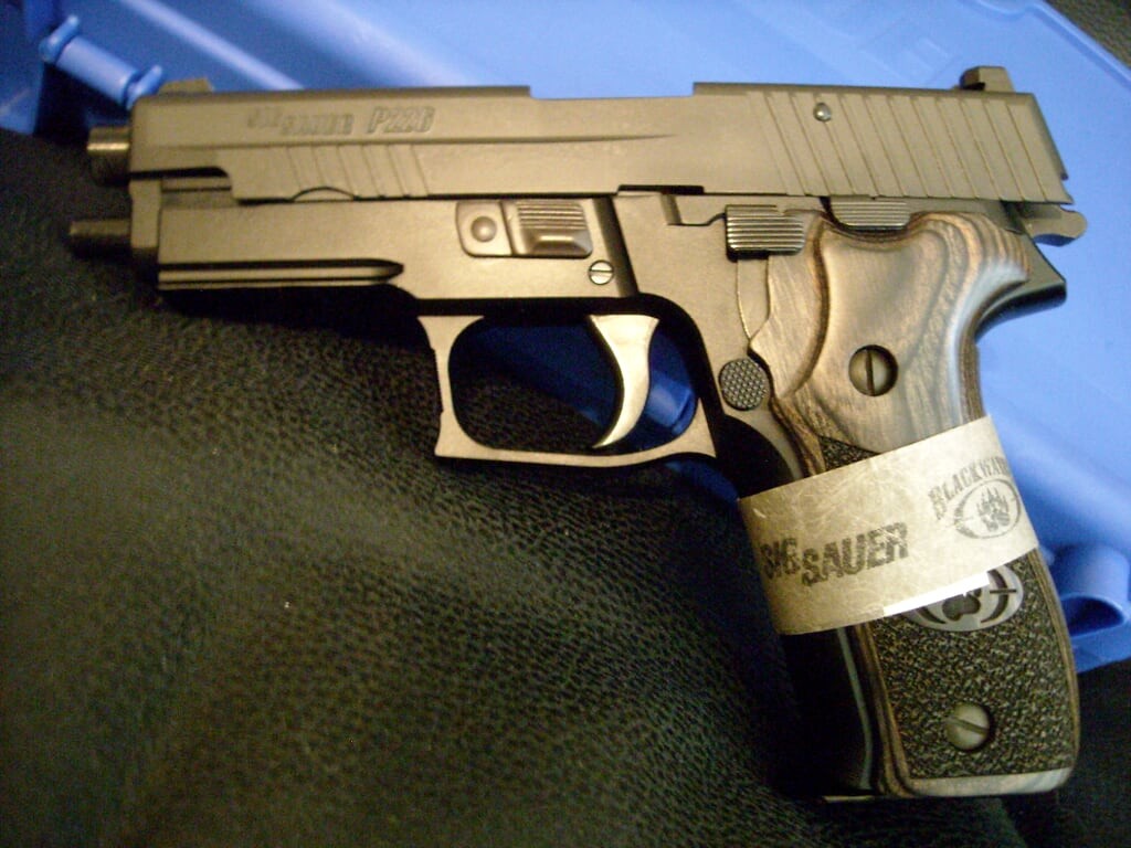 Late-run P226 Blackwater with updated logo on the wood grips