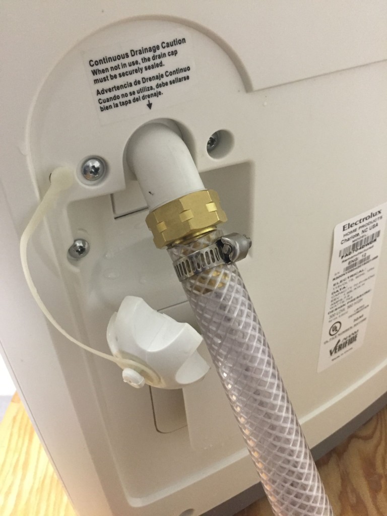 Attaching a drain hose to the dehumidifier
