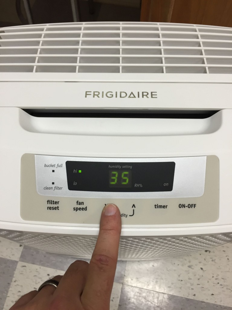 At what humidity level should one set a dehumidifier?